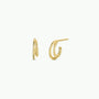 The Double Hoop - Earring is a pair of small gold plated hoops featuring a twisted design on one side, shown against a plain white background.