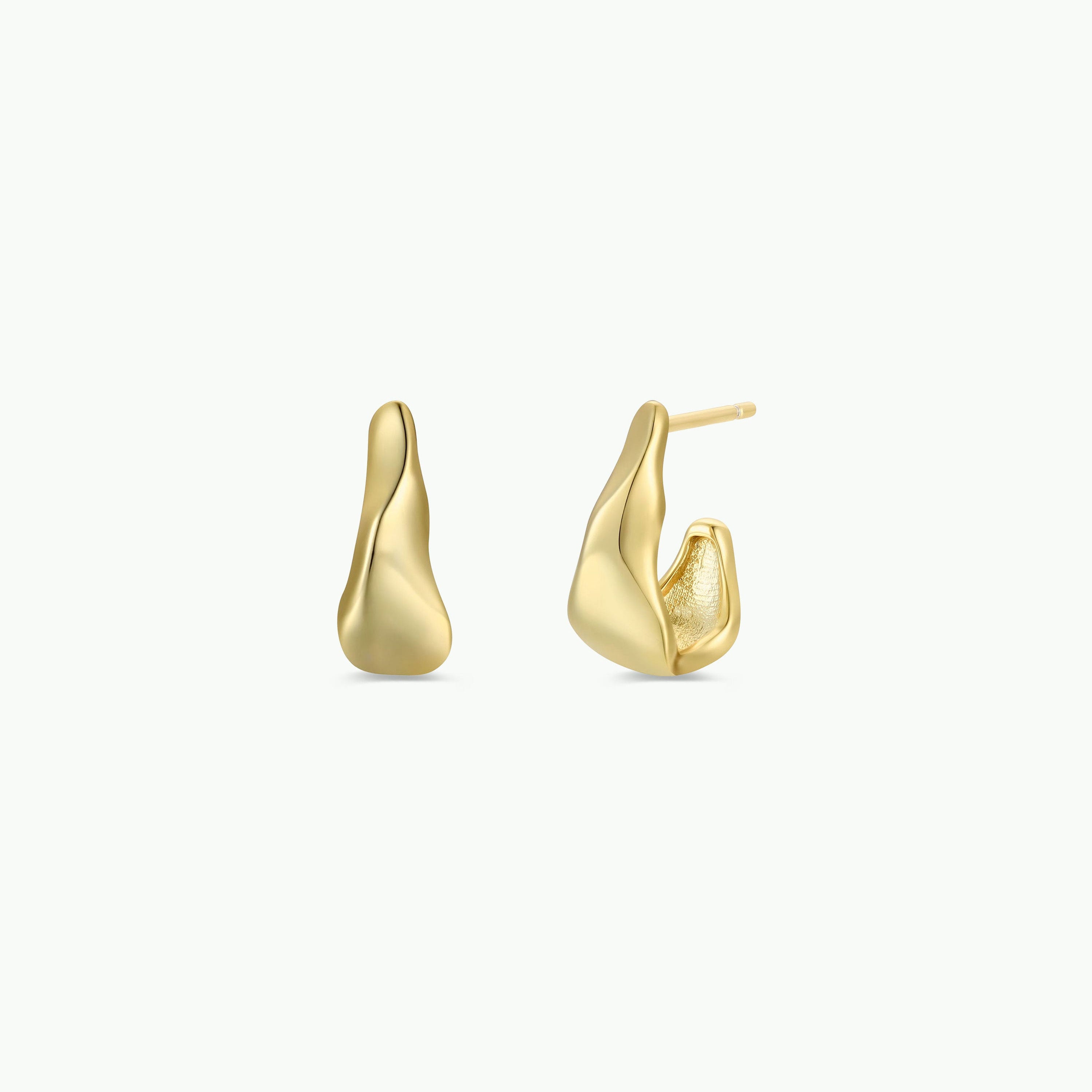 The Small Ripple Gold Hoop features a modern, sculptural design with smooth, abstract waves and sterling silver posts. Shown against a white background, one earring is displayed from the front and the other from the side.