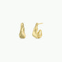 The Small Ripple Gold Hoop features a modern, sculptural design with smooth, abstract waves and sterling silver posts. Shown against a white background, one earring is displayed from the front and the other from the side.