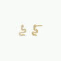 The Pavé Snake earrings are gold plated and serpent-shaped, each adorned with sparkling CZ stones along the body, shown against a plain white background.
