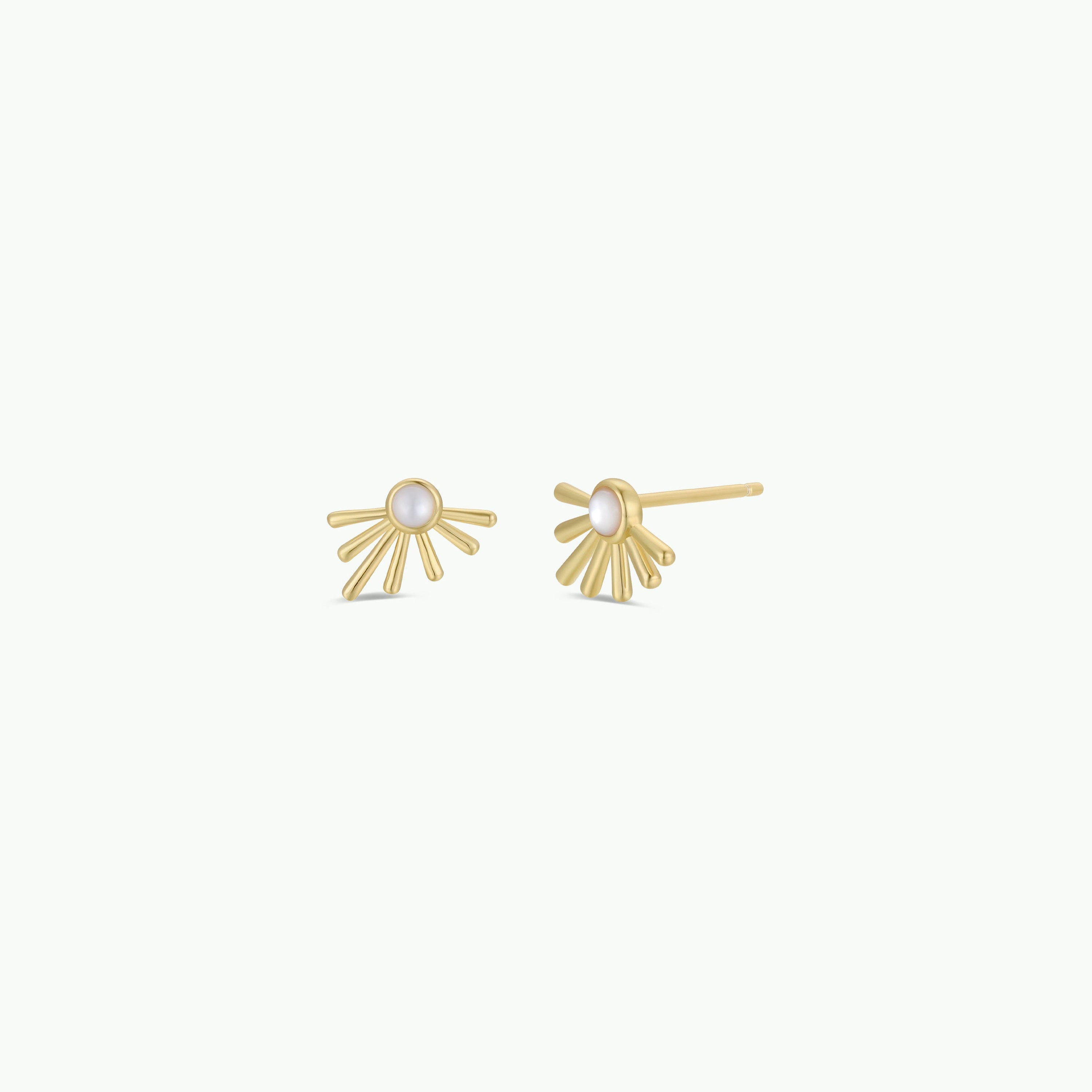 The Sun Ray - White Opal earrings feature a central white pearl with radiating lines in an Opal Sun Ray motif, finished in 18k gold plating and shown against a plain white background.