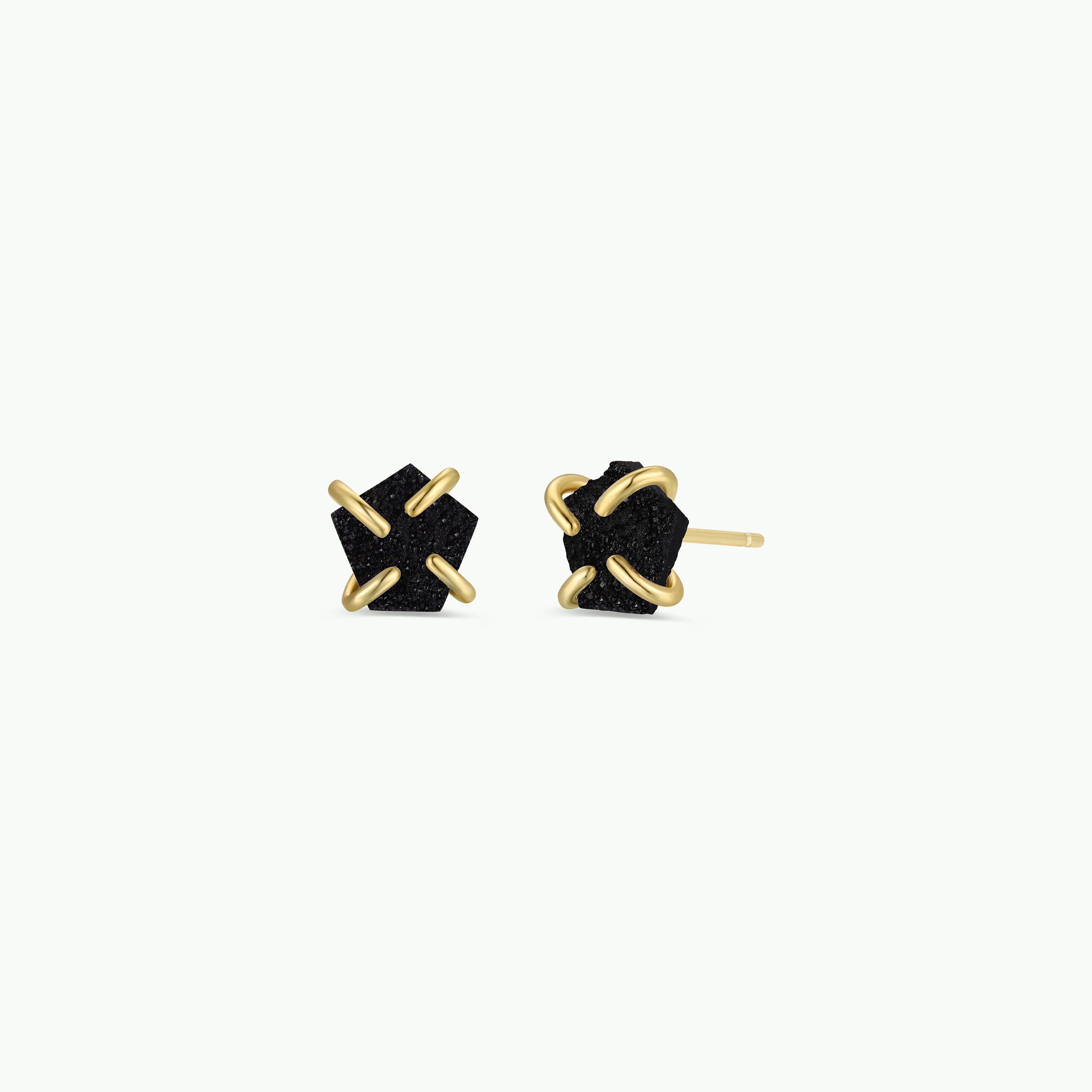 The Black Druzy Prong earrings showcase irregular-shaped natural druzy stones secured by four gold prongs on each earring, finished with 18k gold plating, photographed against a plain white background.