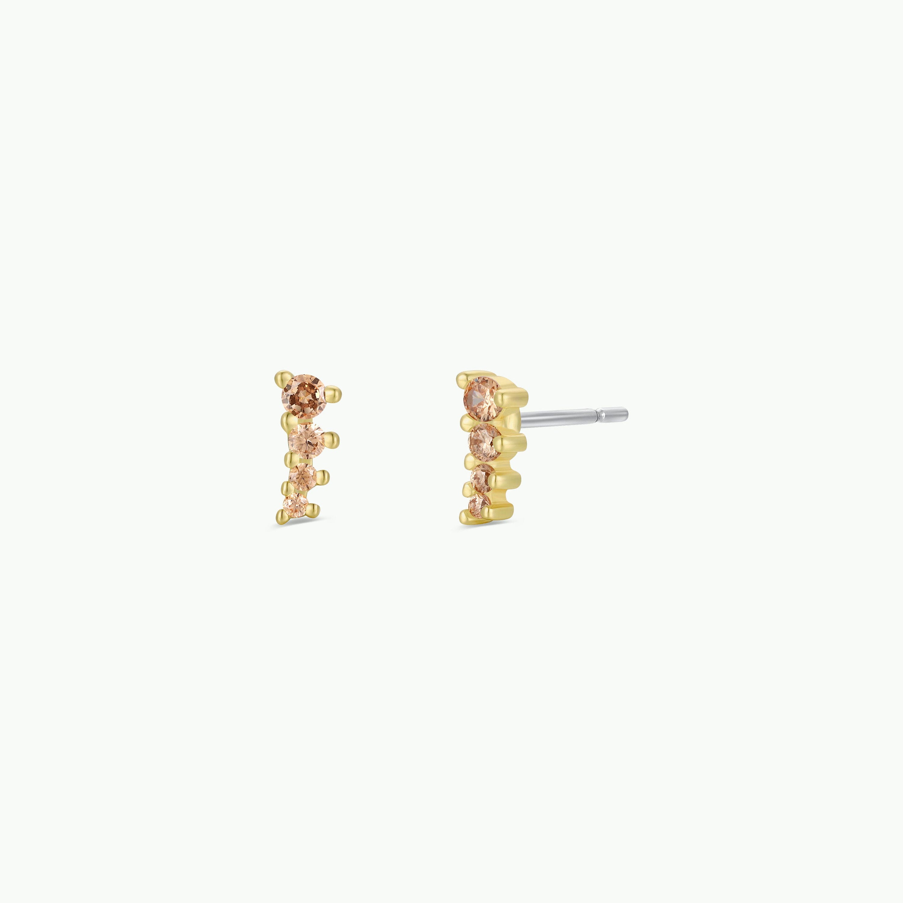 A pair of Mini Crawler - Champagne CZ - Gold Earrings with five small round champagne stones arranged vertically, shown from the front and side on a plain white background.