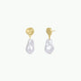 Abstract Pearl and Gold Drop Earrings featuring irregular gold-plated studs and a single dangling organic-shaped white pearl, displayed on a plain white background.