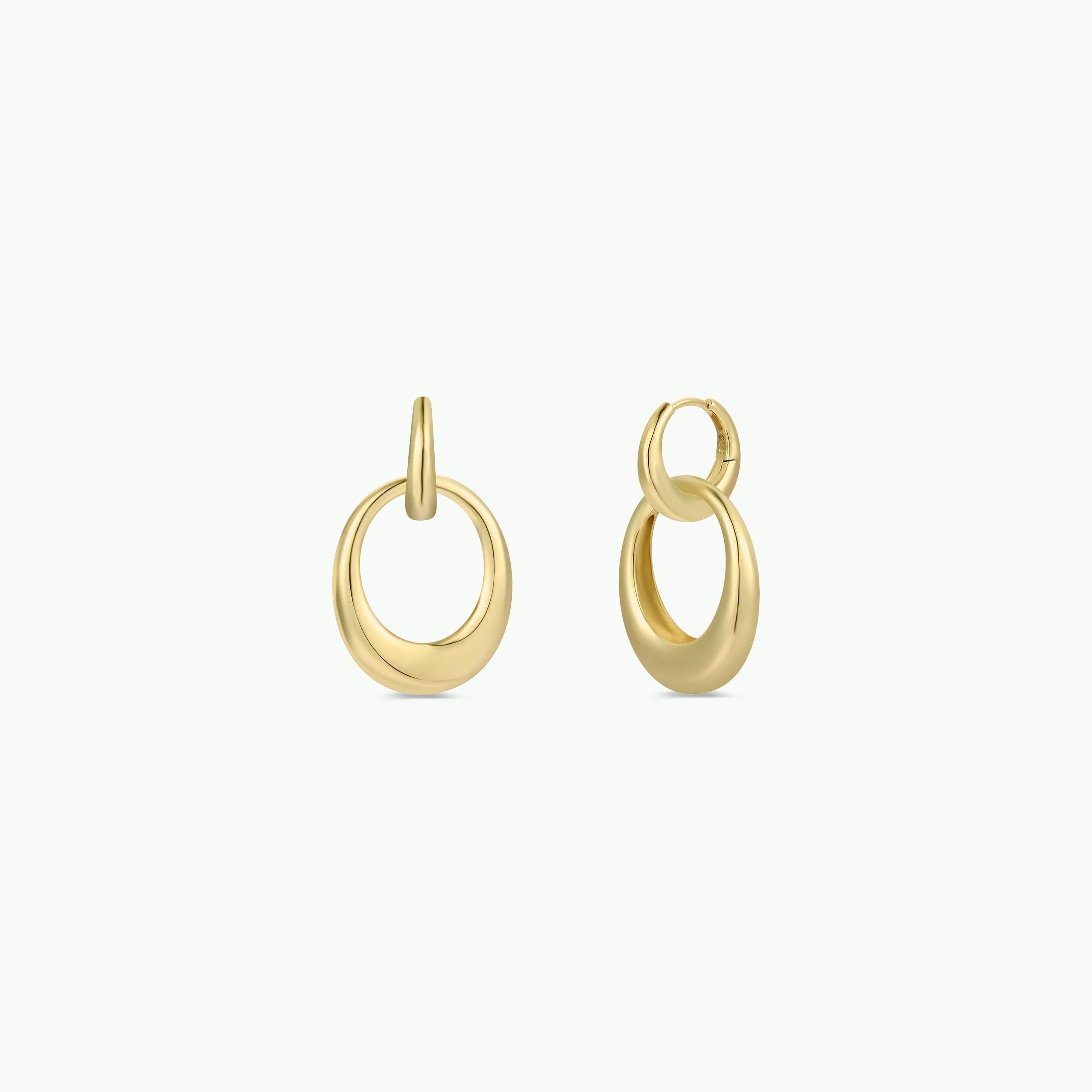 The Coupled Hoop - Earring features a lightweight, modern double hoop design with 18k gold plating, shown against a plain white background.