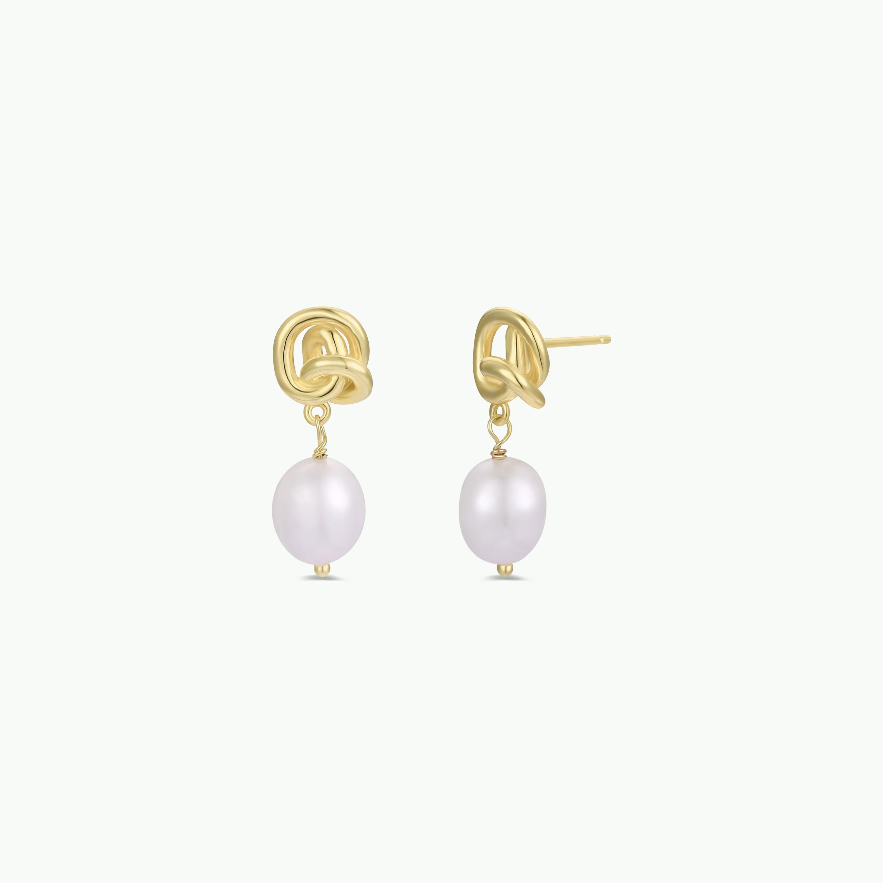 The Pearl Knot - Earring features gold knot studs with dangling round white freshwater pearls in an 18k gold-plated finish, shown on a plain white background.