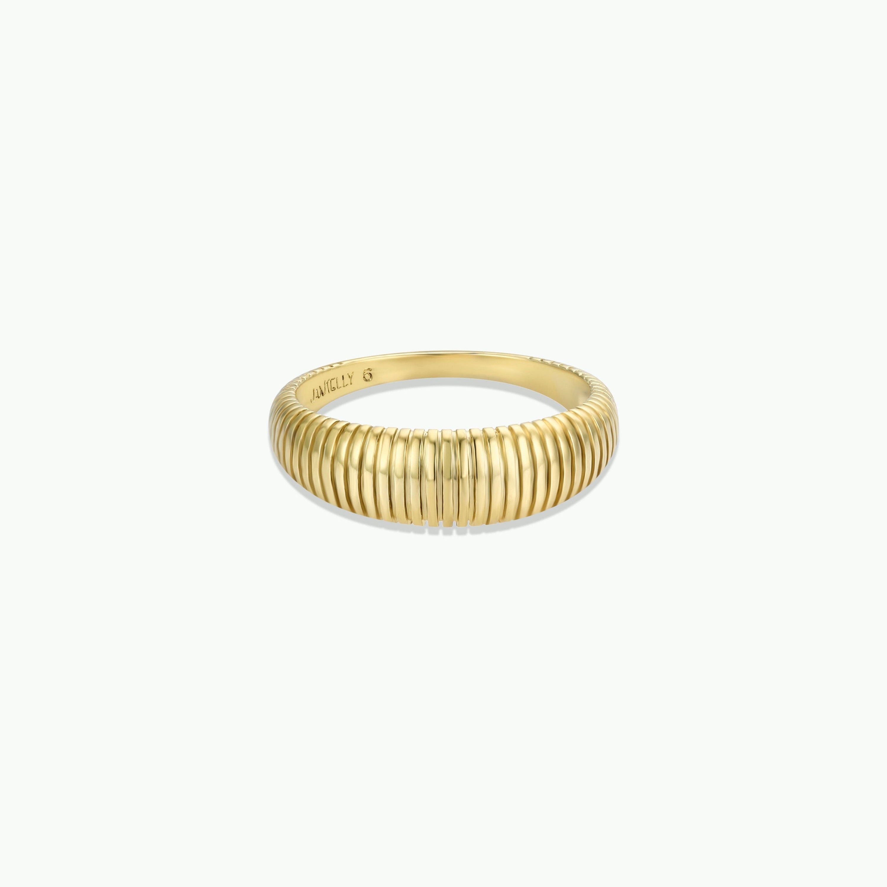 The Ridged Ring features a ribbed, textured band plated in radiant 18k gold, shown on a white background.