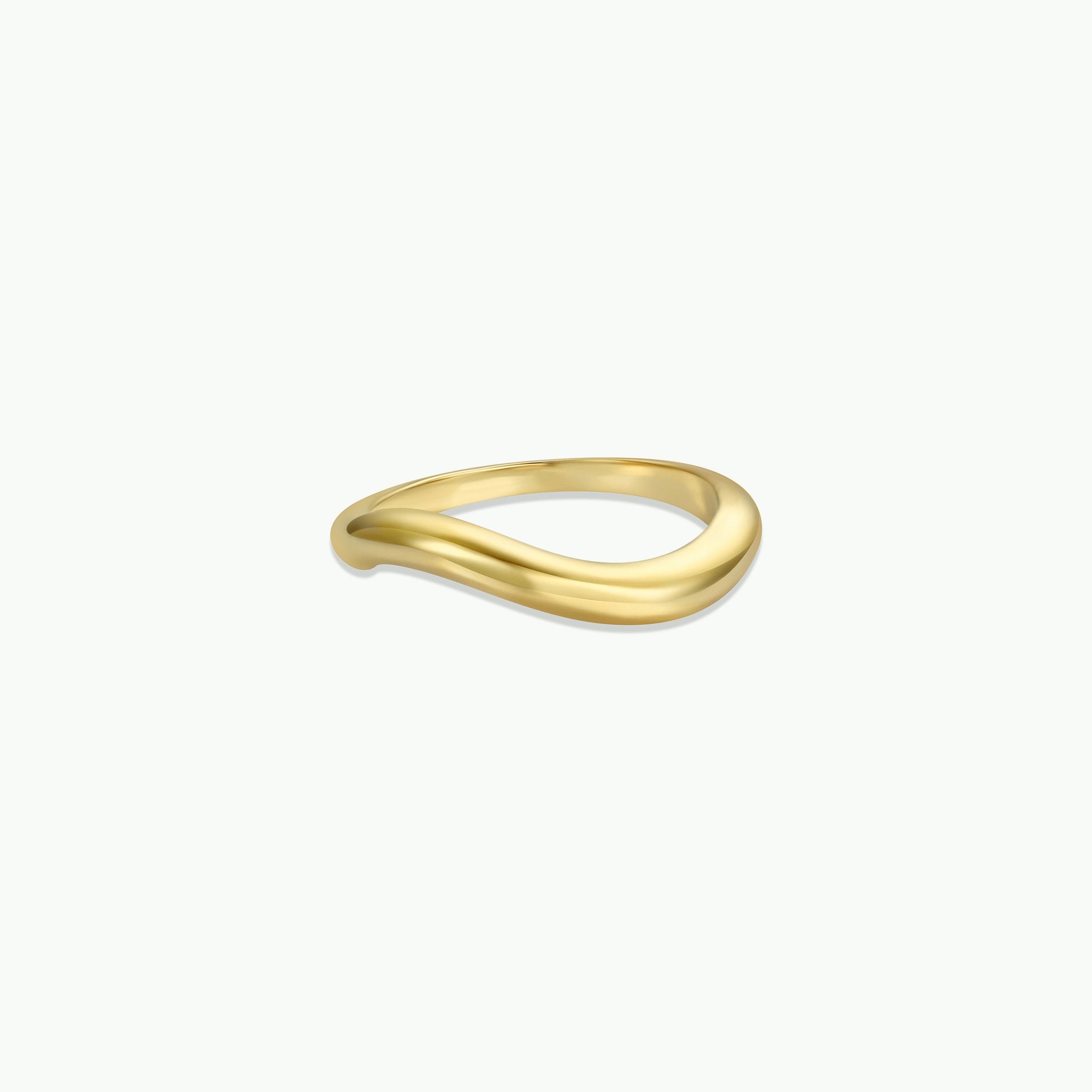 The Wave Ring features a simple, elegant gold wave design with a gentle curve, crafted in 18k gold and shown on a plain white background—an ideal long-lasting jewelry piece for any collection.