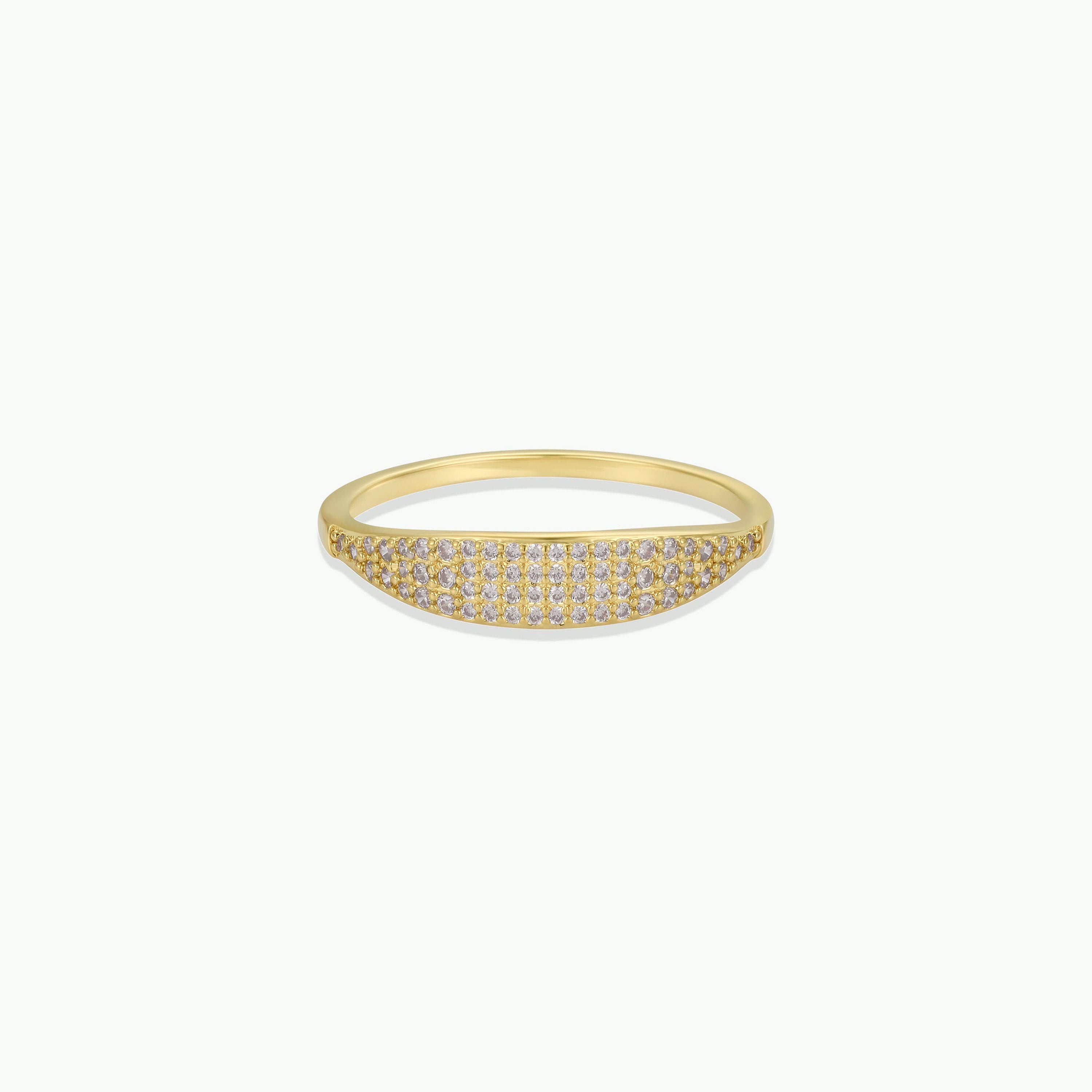 The Gold Ring - Tapered Pave - Champagne CZ features a slim 18k gold-plated band with a curved rectangular top set with sparkling champagne cubic zirconia, shown against a plain white background.