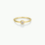 The Simple Stud Ring features a thin gold band with a single round cubic zirconia in a bezel setting, shown against a plain white background.