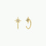 The Star Huggie earrings are 18k gold plated, star-shaped, and each features a small clear gemstone at the center, shown on a plain white background.