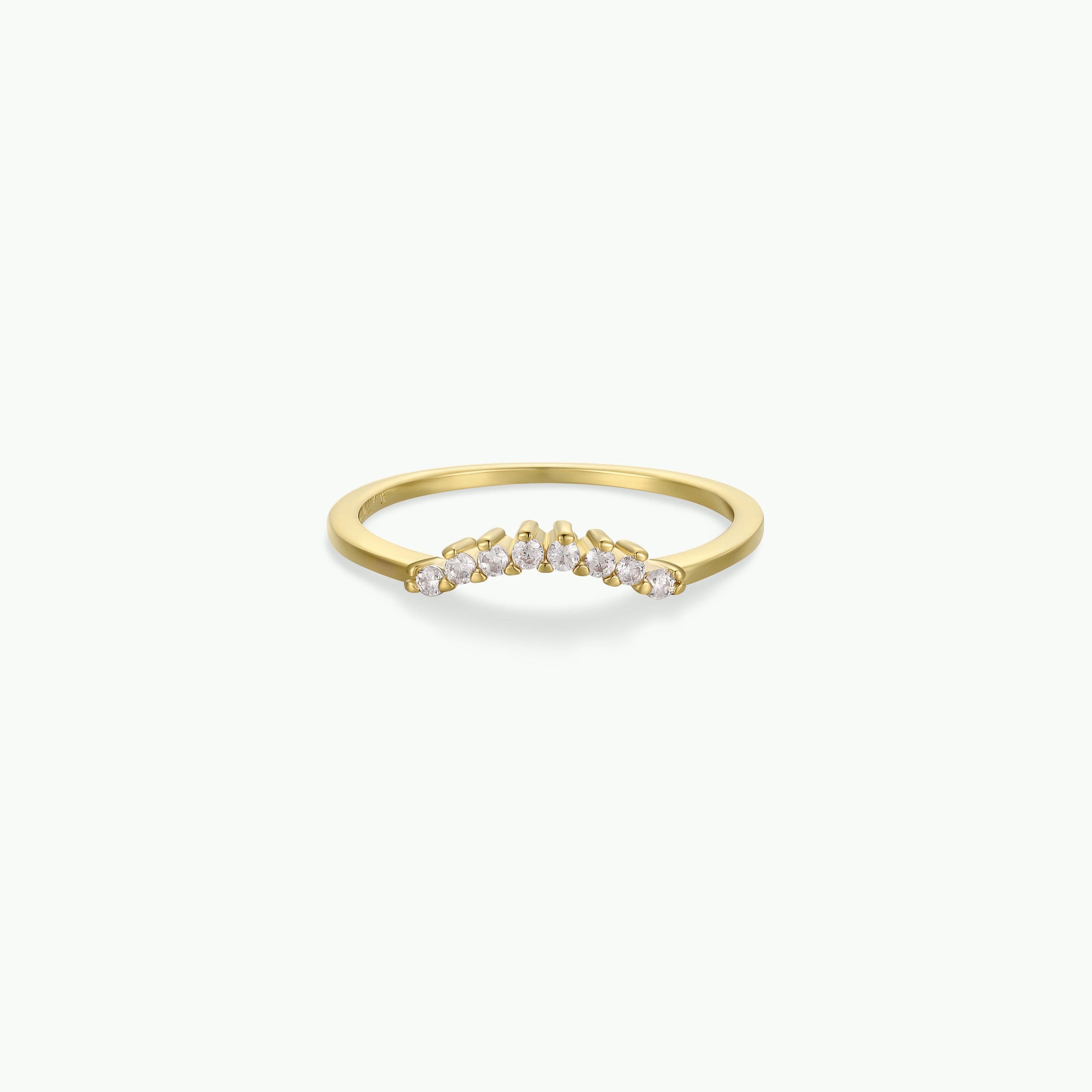 The Ring - Arched Crown - Champagne is a stackable ring with a V-shaped curve, adorned with small round champagne diamonds on an 18k gold plated band. It is shown against a plain white background.