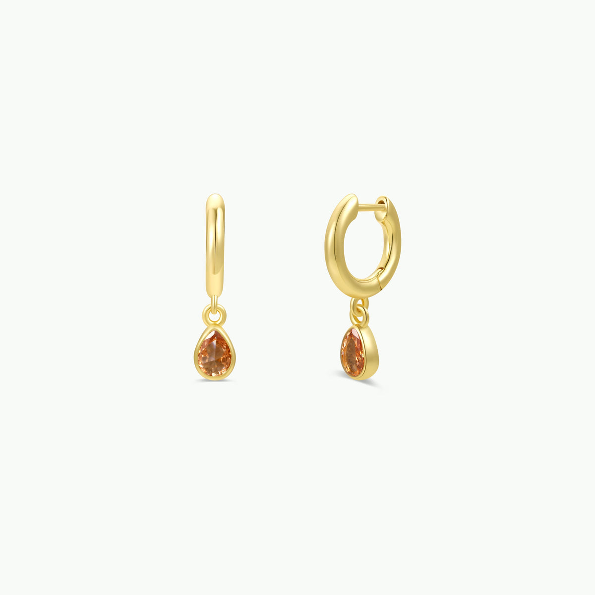 JaxKelly Teardrop Charm Hoop - Champagne CZ earrings with dangling, pear-shaped orange gemstone teardrops.