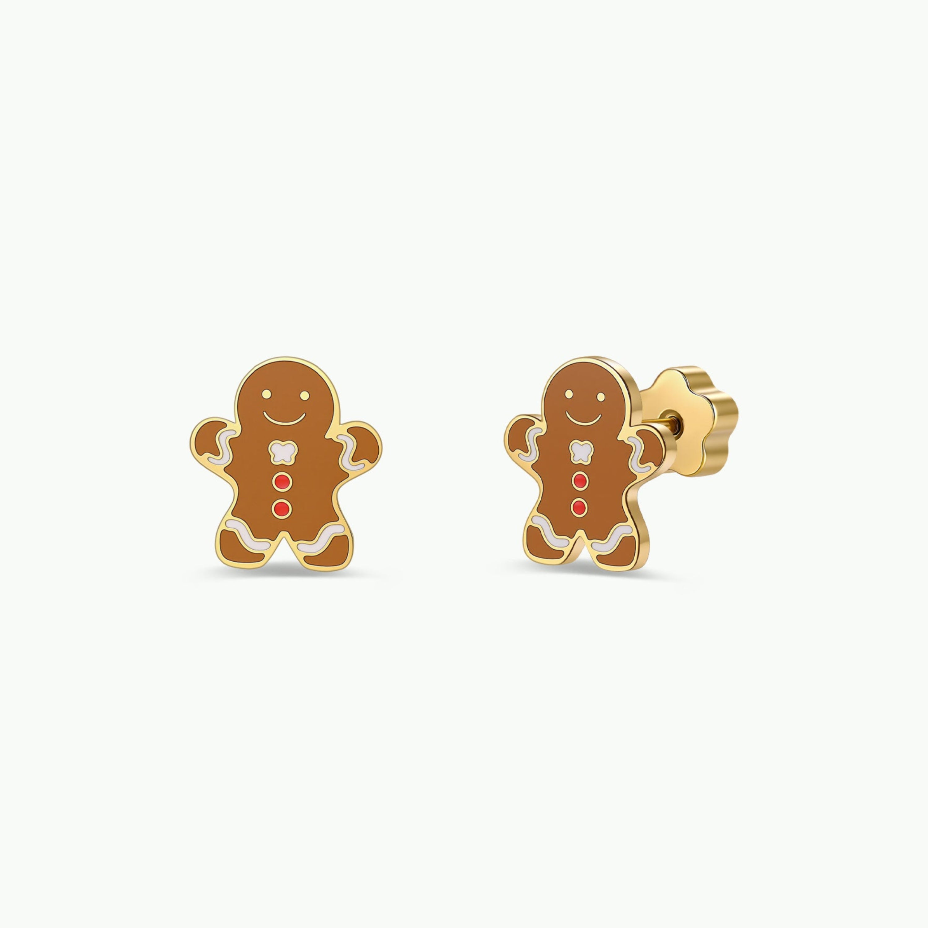 JaxKelly Gingerbread Man Enamel Flat Back Kids Earrings feature smiling gingerbread men with white icing accents and two red buttons on each. Crafted from surgical-grade stainless steel, these hypoallergenic earrings are ideal for sensitive ears. Presented on a plain white background.