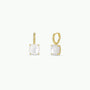 The Gemstone Mini Drop - Mother of Pearl earrings feature square-cut mother of pearl stones in four-prong gold settings, offering an elegant update to classic gold hoops, shown against a plain white background.