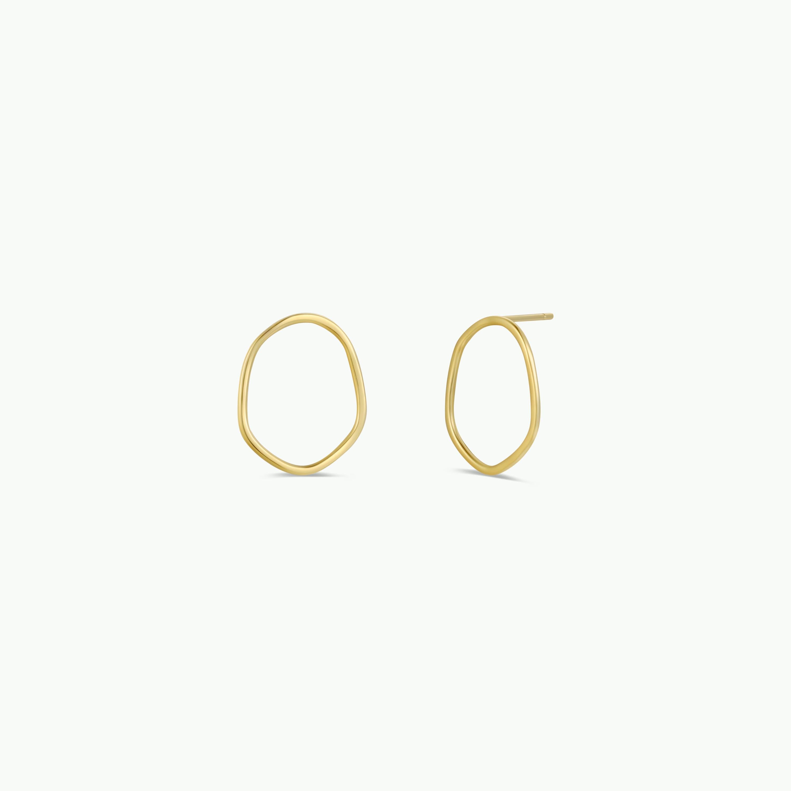 The Gold Organic Hoop earrings feature minimalist, irregular oval shapes with subtle 18k gold plating, shown against a plain white background.