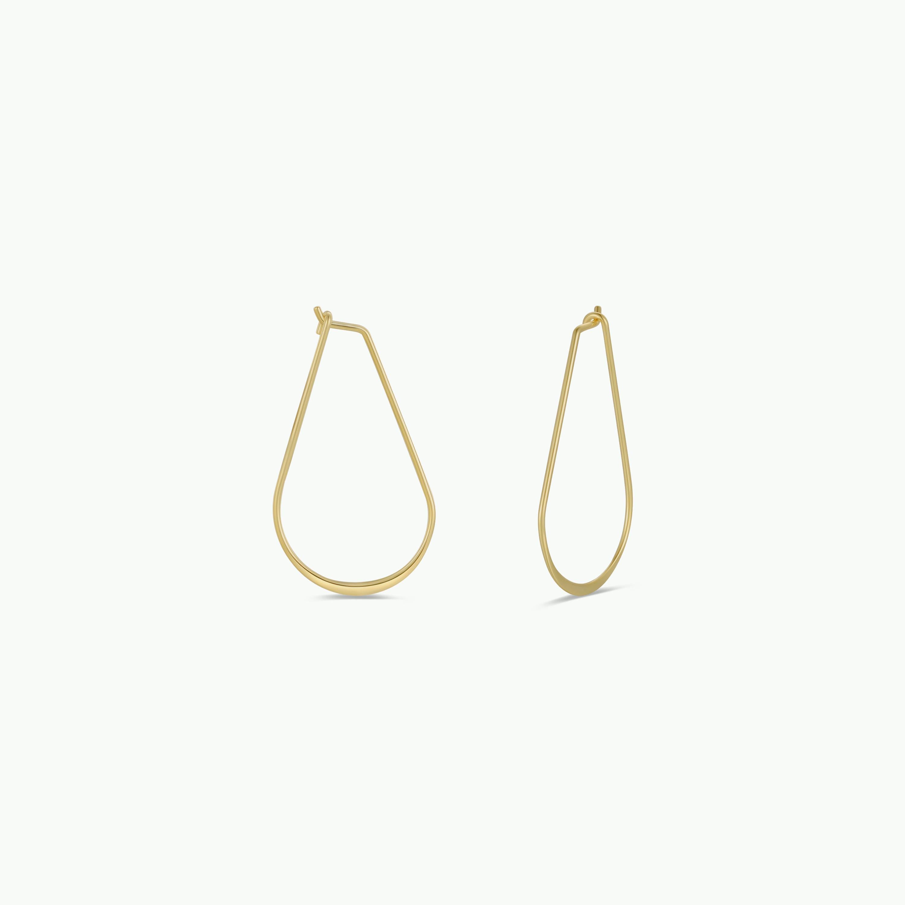 Gold Long Oval Hoop earrings, featuring a sleek open teardrop shape, are displayed on a white background—ideal minimalist gold earrings for your daily jewelry collection.