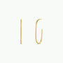 The Gold Large Open Hoop earrings, featuring 18k gold plating, are displayed from the side to highlight their thin, lightweight hoops and from the front to showcase their open, elongated oval design against a plain white background.