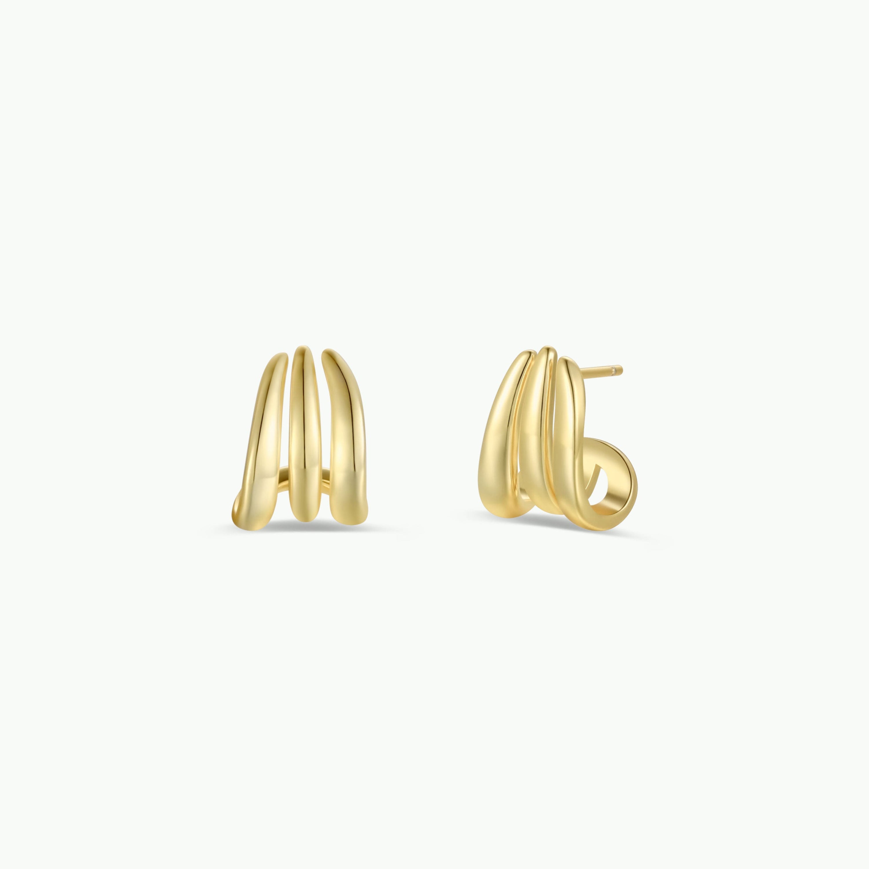 The Gold Three Hoop Huggie features gold-plated, triple-hoop studs with a sleek, modern curve—ideal for minimalist jewelry lovers. Shown on a plain white background.