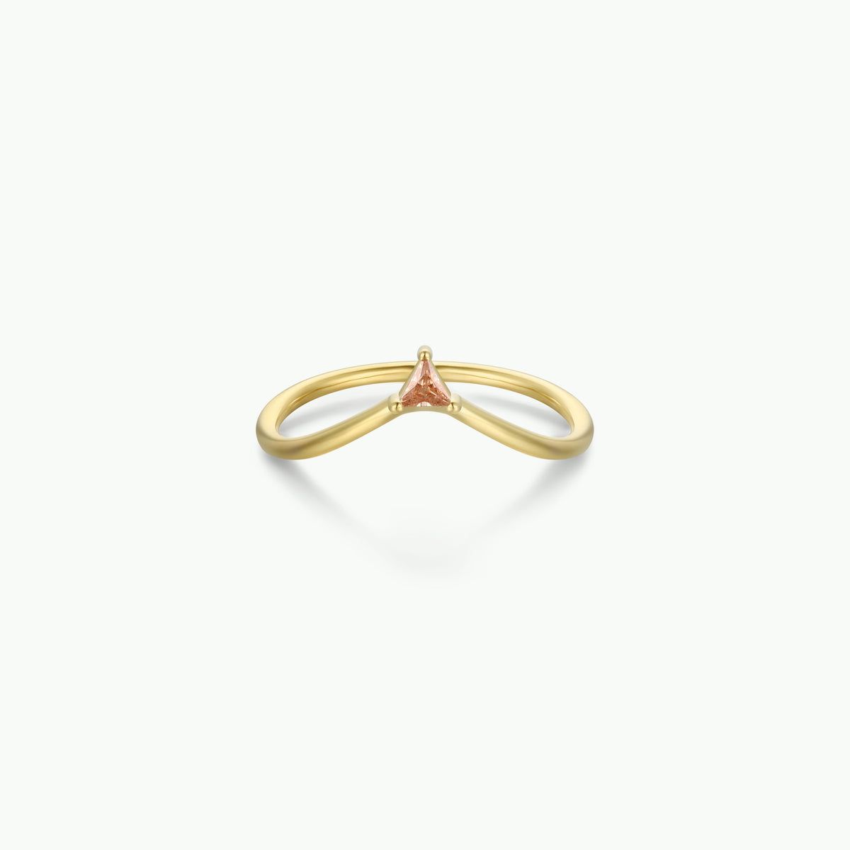 Introducing the Arched Triangle Ring - Champagne by JaxKelly: a delicate 18kt gold band with a subtle arched silhouette, highlighted by a small triangular champagne-colored gemstone at its center for an elegant, heirloom-inspired appeal.