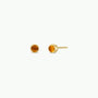 The JaxKelly Simple Stud Earring features small, round amber gemstones in gold-plated bezel settings with sterling silver posts, shown against a plain white background.