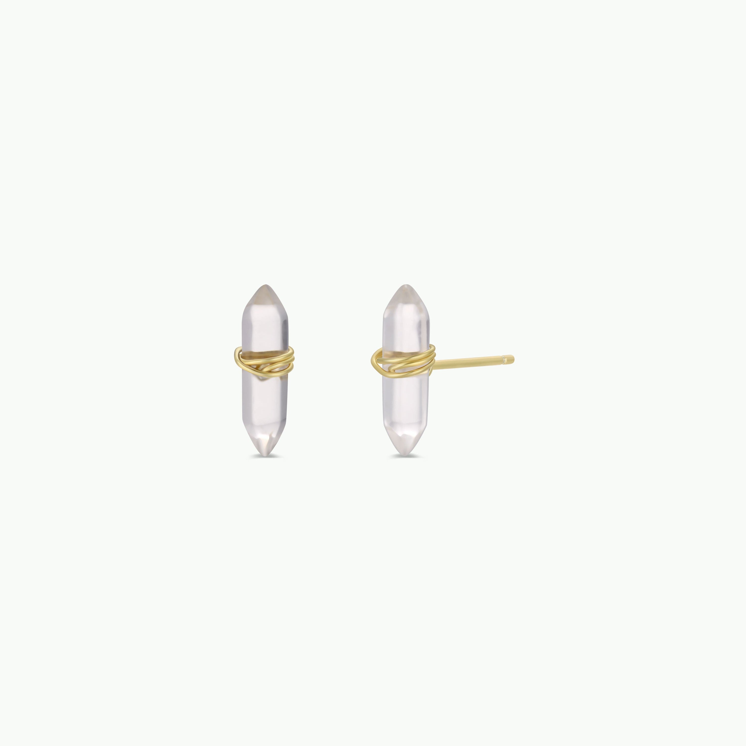 A pair of JaxKelly Clear Quartz Mineral Point earrings feature crystal points wrapped in gold wire, displayed on a white background. One shows the front crystals, the other the side with gold stud post—tarnish-free cleansing jewelry.