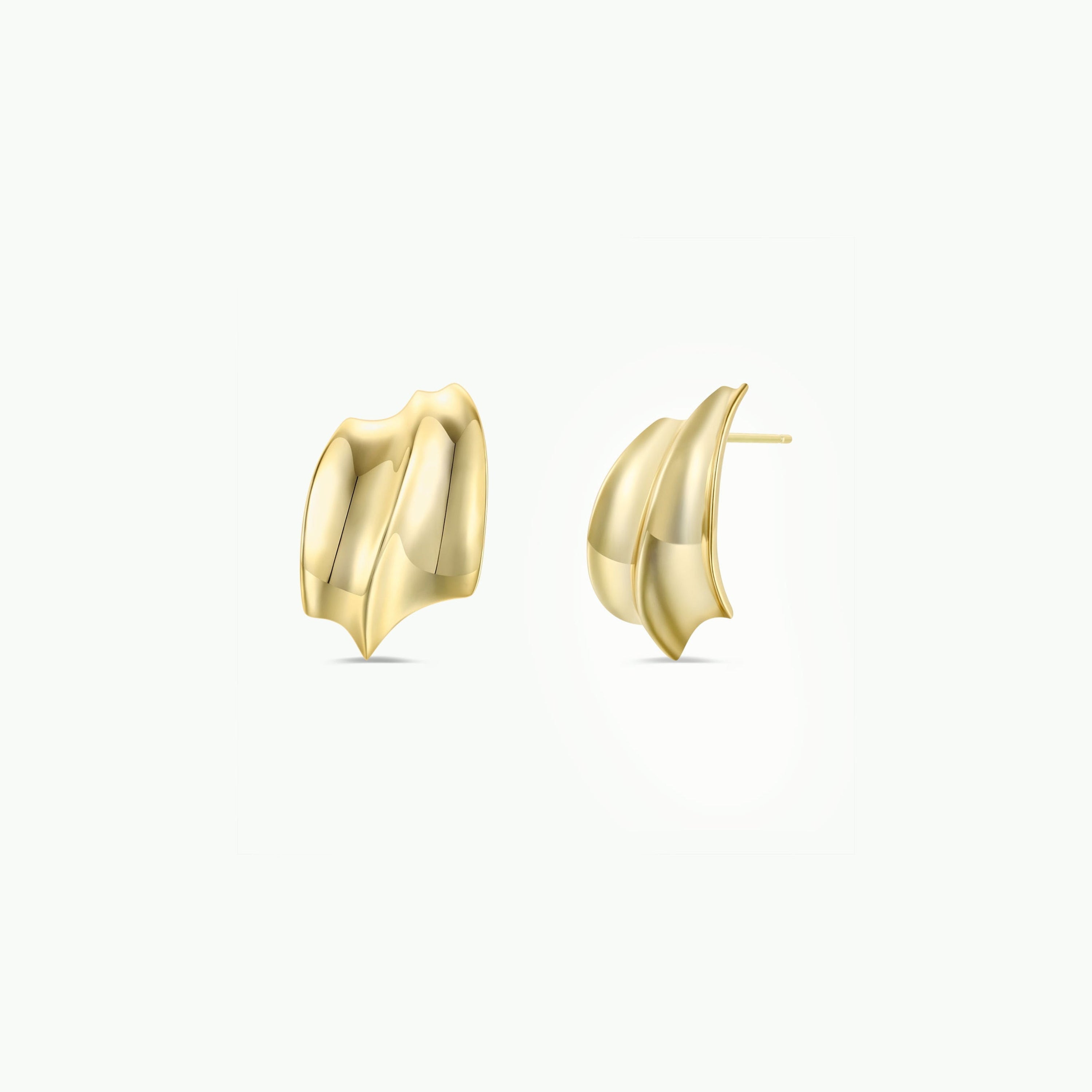 JaxKelly's Gold Bold Wave earrings are sculptural gold-plated studs with smooth, curved surfaces and pointed ends, offering a modern wave design. Shown against a white background.