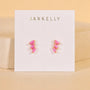 Offset Trio - Pink Opal by JaxKelly: gold plated hypoallergenic stud earrings featuring pink rectangular stones, shown on a white JaxKelly card against a neutral beige background—perfect for everyday elegance.