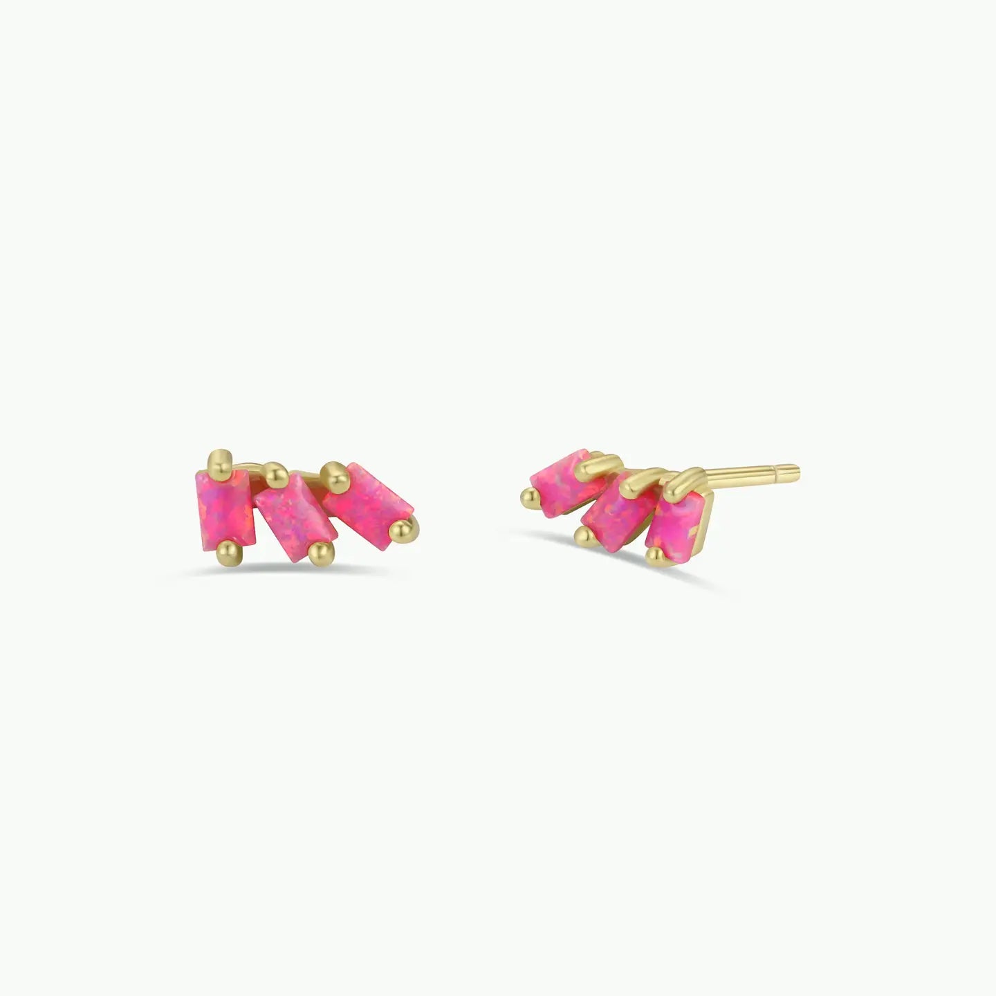 The JaxKelly Offset Trio - Pink Opal stud earrings feature three small rectangular pink stones set in gold prongs, designed to be hypoallergenic and shown against a plain white background.