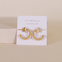 The Petite Flower Hoop, a pair of gold beaded earrings with sterling silver posts, is displayed on a white JaxKelly card reading WEAR GOOD VIBES against a soft, neutral background.