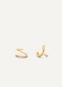 The Pave Spiral - Earring is shown on a white background, featuring two gold ear cuffs: one with a zigzag shape and pave stones, the other with a smooth spiral design adorned with sparkling stones along its edge.