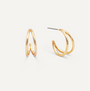The Illusion Double Hoop - Gold Earrings feature a sleek, modern double-band design in gold-tone. Displayed on a white background, one earring stands upright while the other lies flat to show the post for pierced ears.