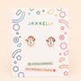 Snowman Enamel Flat Back Kids Earrings by JaxKelly, featuring snowman shapes with pink hats, displayed on a white JaxKelly card with colorful geometric designs and text that reads HYPOALLERGENIC and KID-FRIENDLY POSTS.
