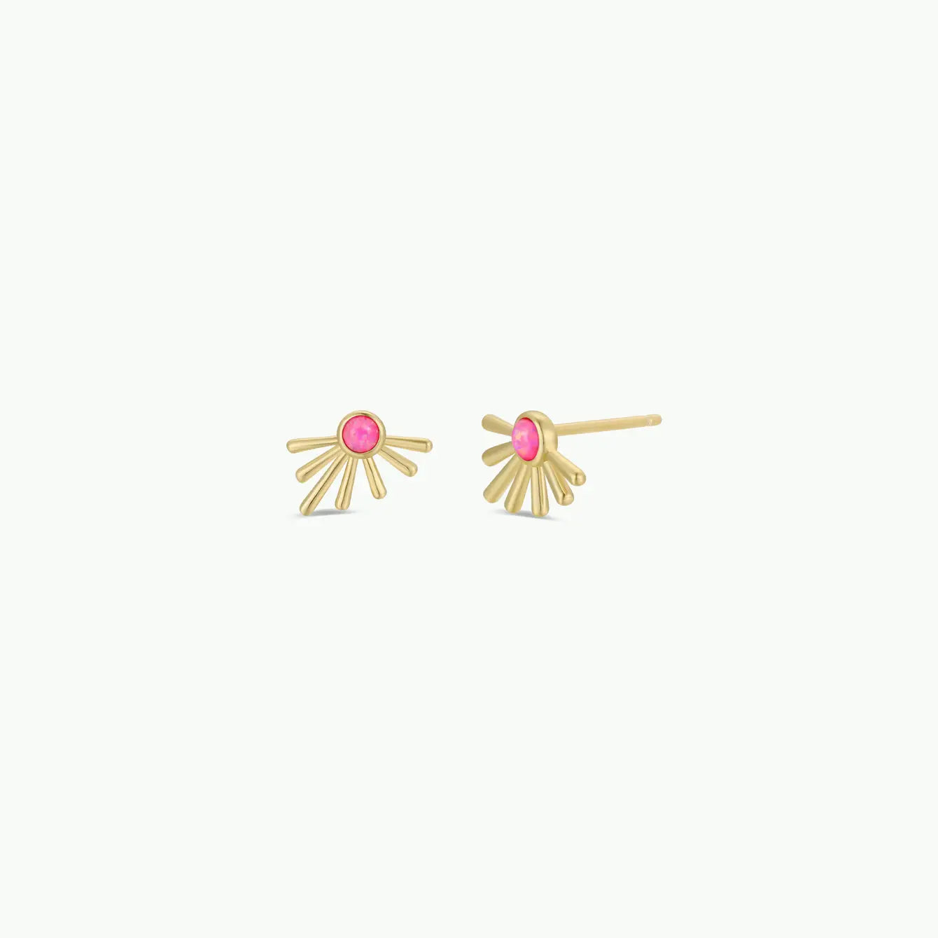 The Sun Ray - Pink Opal earrings by JaxKelly feature a sunburst design with a pink opal center on each hypoallergenic gold stud, shown on a plain white background.