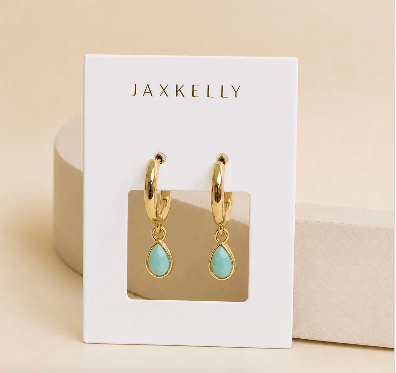 Teardrop shaped charm with an amazonite stone on a small gold hoop