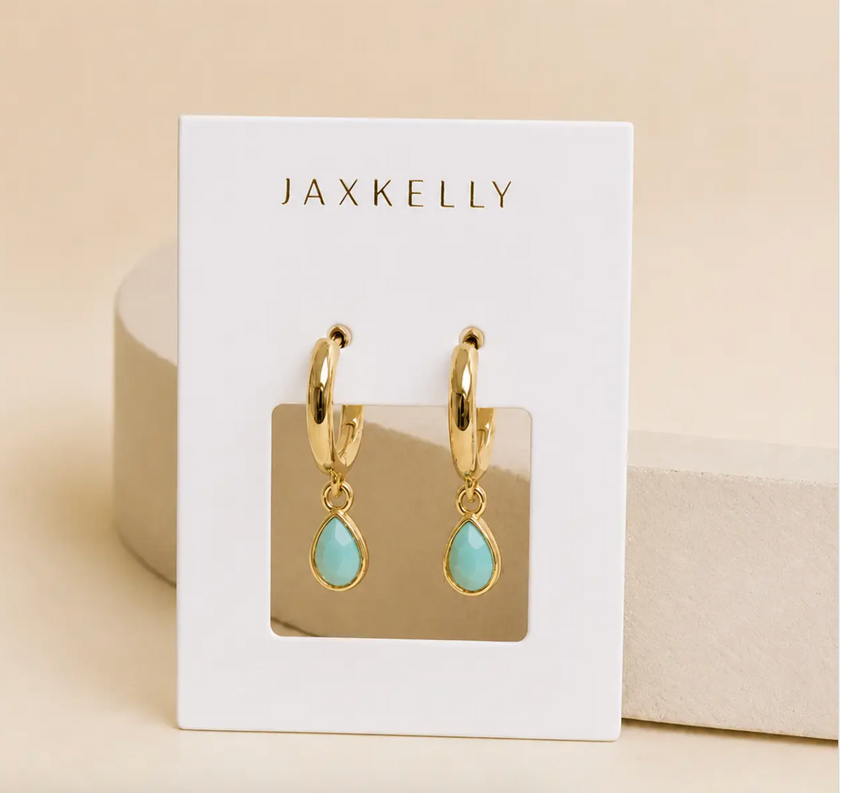 Teardrop shaped charm with an amazonite stone on a small gold hoop