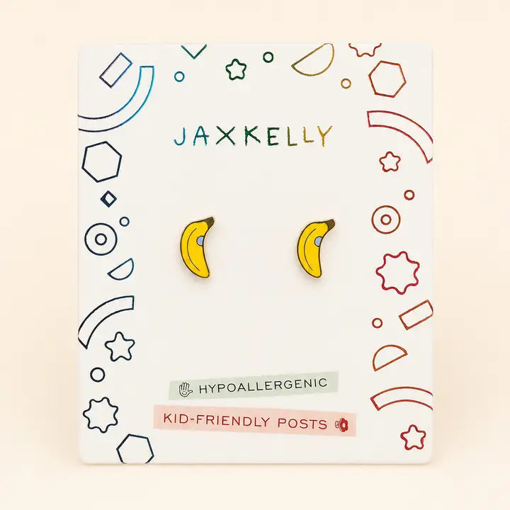 A pair of JaxKelly Banana Enamel Flat Back Kids Earrings for sensitive ears, displayed on a decorative card labeled “Hypoallergenic and Kid-Friendly Posts,” featuring colorful geometric designs around the edges.