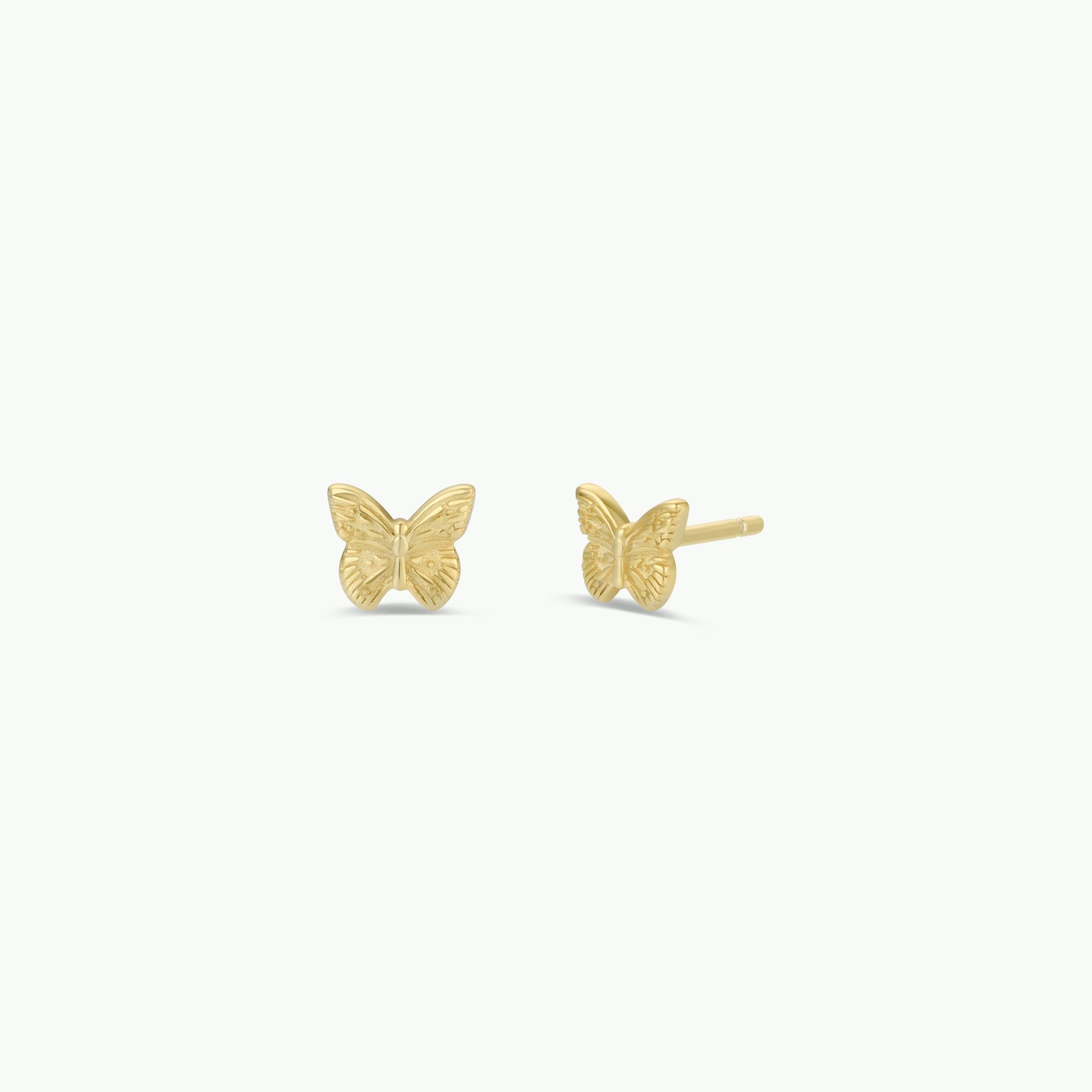 JaxKelly’s Butterfly stud earrings feature 18k gold plating and sterling silver posts. Photographed on a plain white background, one earring displays the front and the other the side.