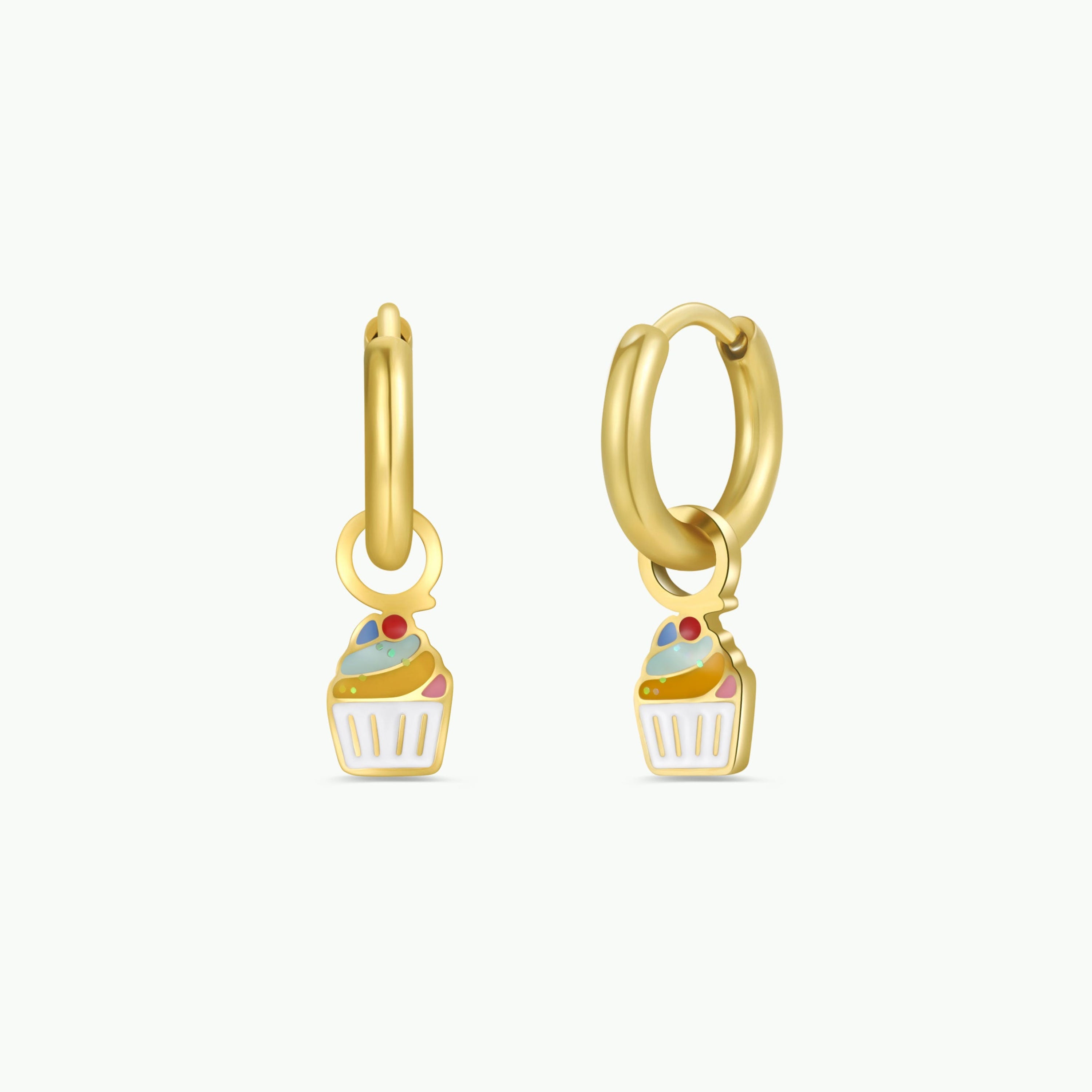 The Cupcake Enamel Charm Hoop features gold hypoallergenic hoops, each with a dangling enamel cupcake charm adorned with colorful icing and a cherry on top—perfect for sensitive ears and showcased on a plain white background.