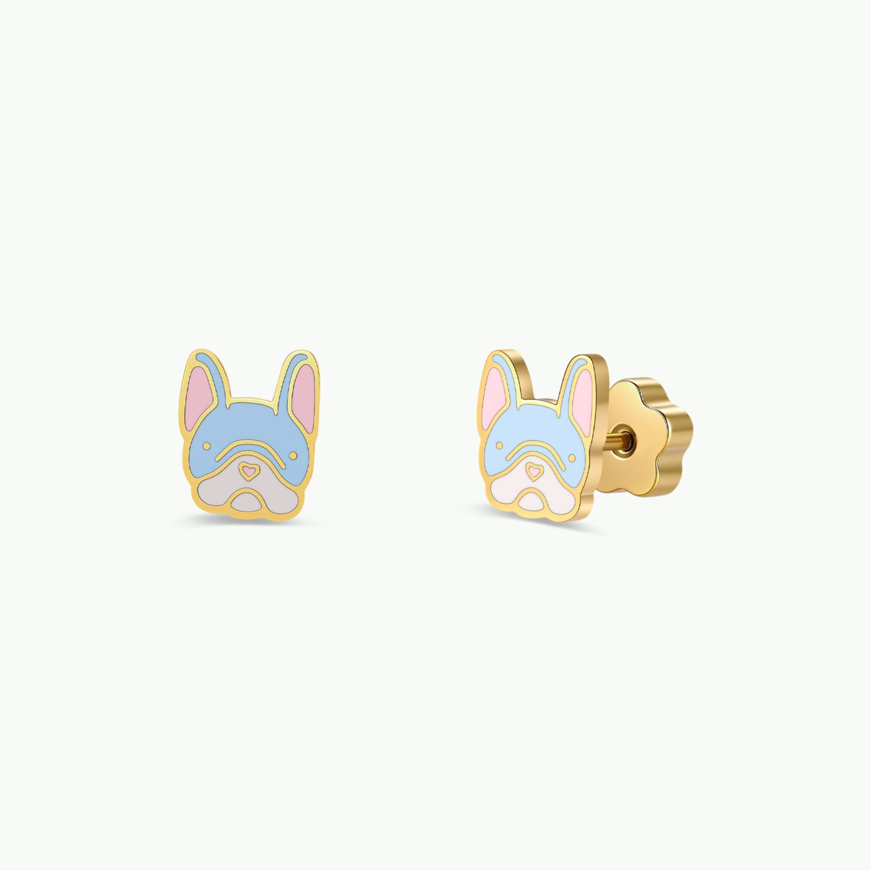 JaxKelly Frenchie Enamel Flat Back Kids Earrings feature two hypoallergenic gold stud earrings shaped like a French bulldog’s face, accented with blue, pink, and white enamel on the ears, face, and nose. These adorable waterproof earrings are perfect for kids with sensitive ears and are showcased on a plain white background.