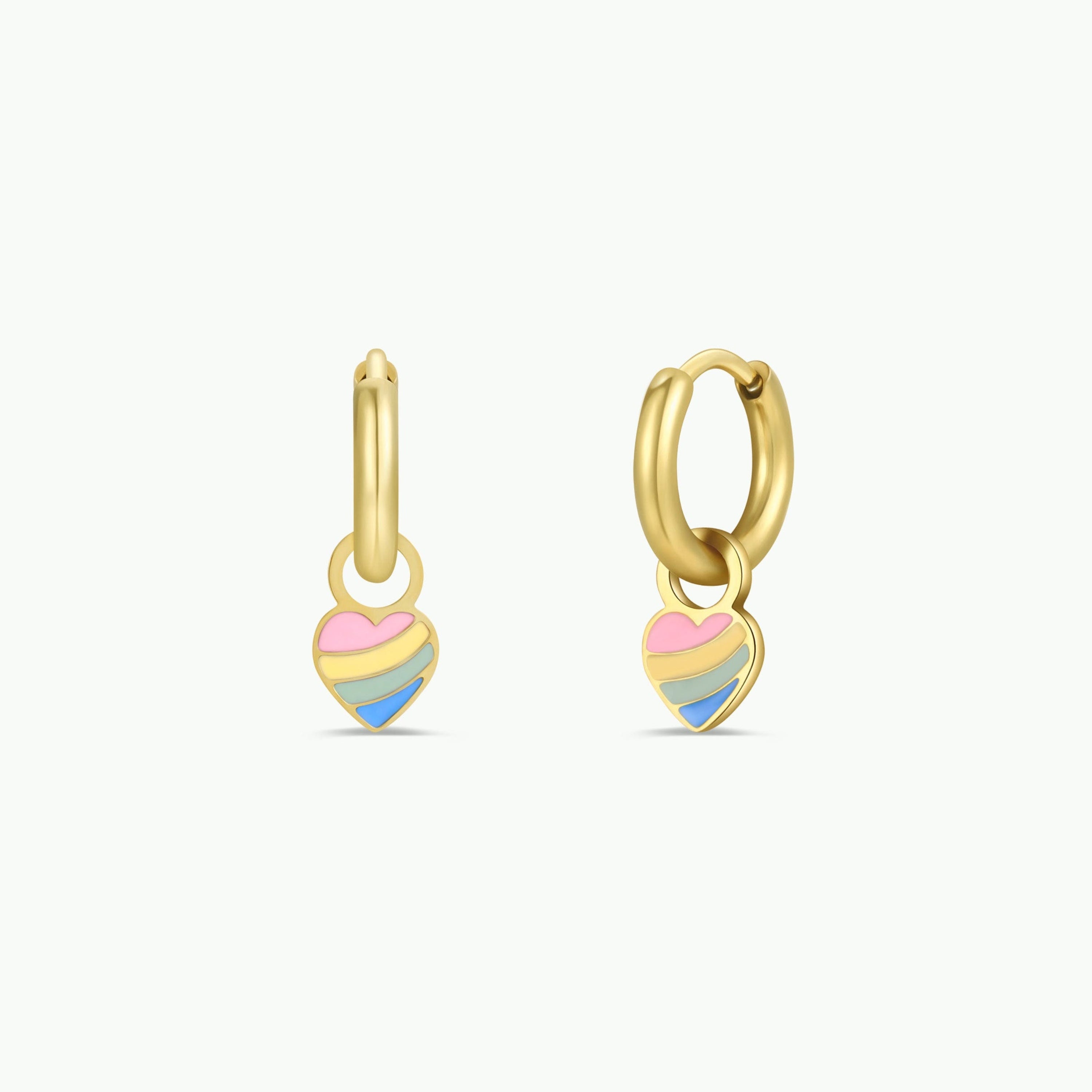 The Heart Enamel Charm Hoop features small gold hoops with dangling heart-shaped charms in pink, blue, and yellow enamel accents—hypoallergenic earrings for sensitive ears, shown on a plain white background.