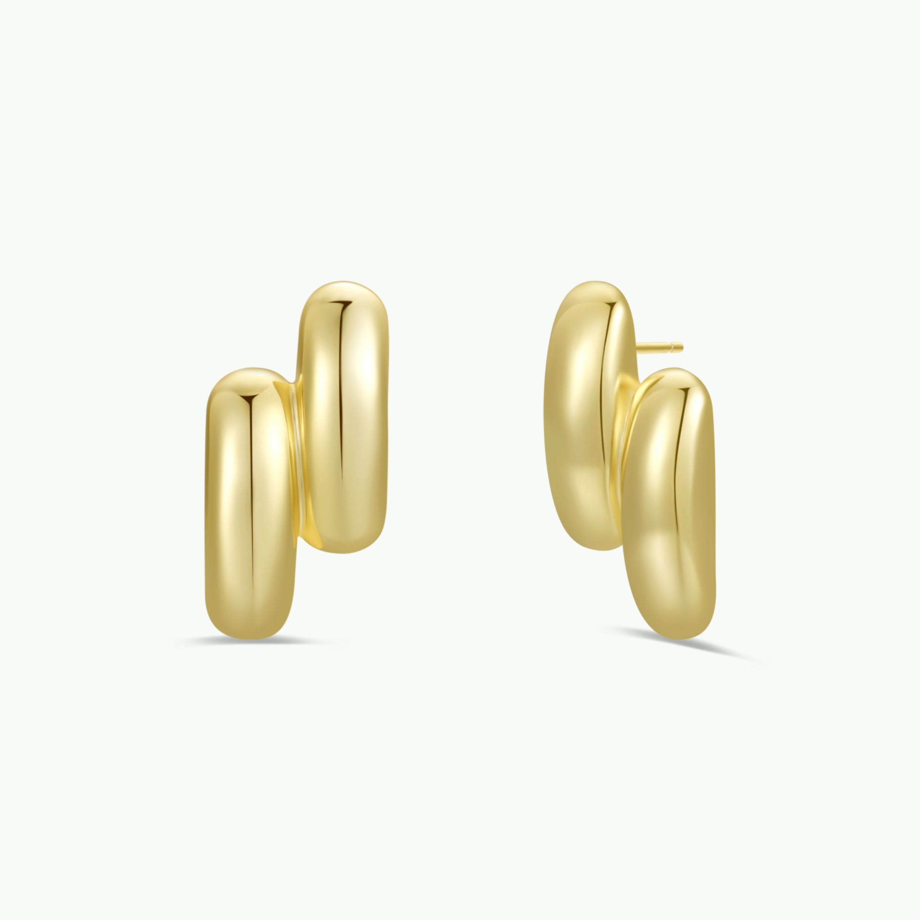The Gold Double Bold Bar earrings feature a chunky, double-hoop design with a smooth, shiny 18k gold-plated finish. Tarnish-free and bold, they're showcased on a plain white background.