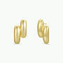The Gold Double Bold Bar earrings feature a chunky, double-hoop design with a smooth, shiny 18k gold-plated finish. Tarnish-free and bold, they're showcased on a plain white background.
