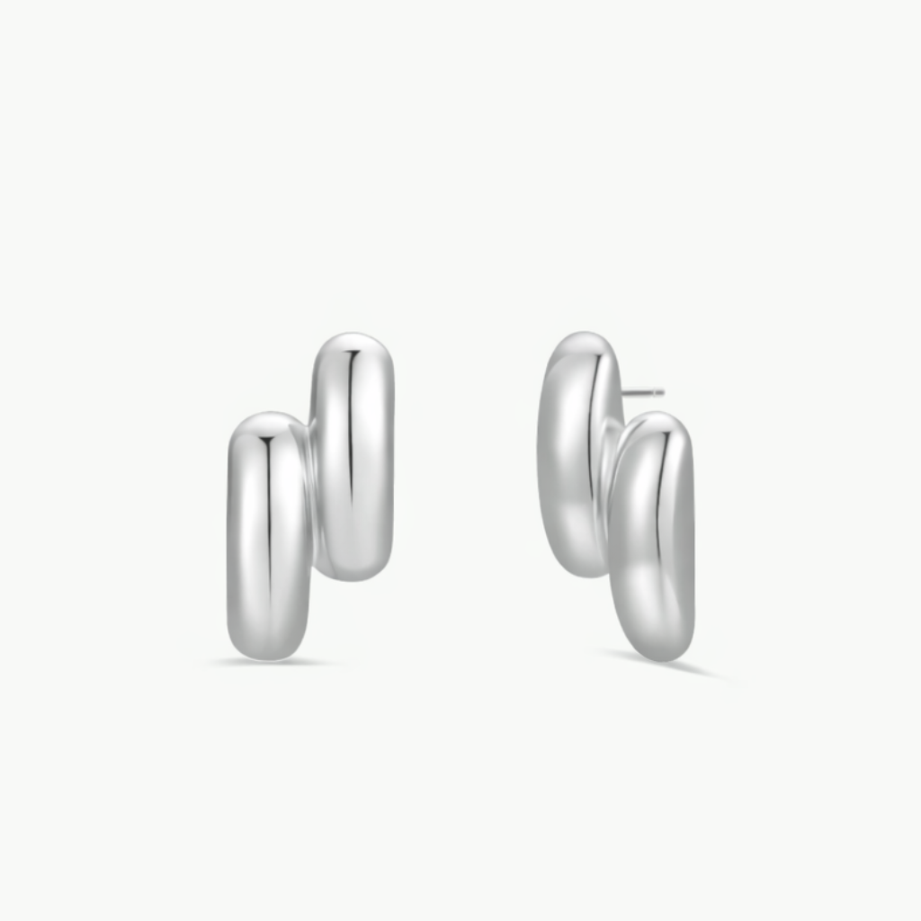 Introducing the Silver Double Bold Bar: modern, rhodium plated earrings with two smooth, rounded, vertically stacked loops, displayed against a plain white background.