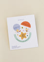 A JaxKelly earring card displays Watermelon Enamel Flat Back Kids Earrings—hypoallergenic, 18k gold plated, with a secure flat screw-back and surgical grade stainless steel. Perfect for kids; warning: contains small parts.