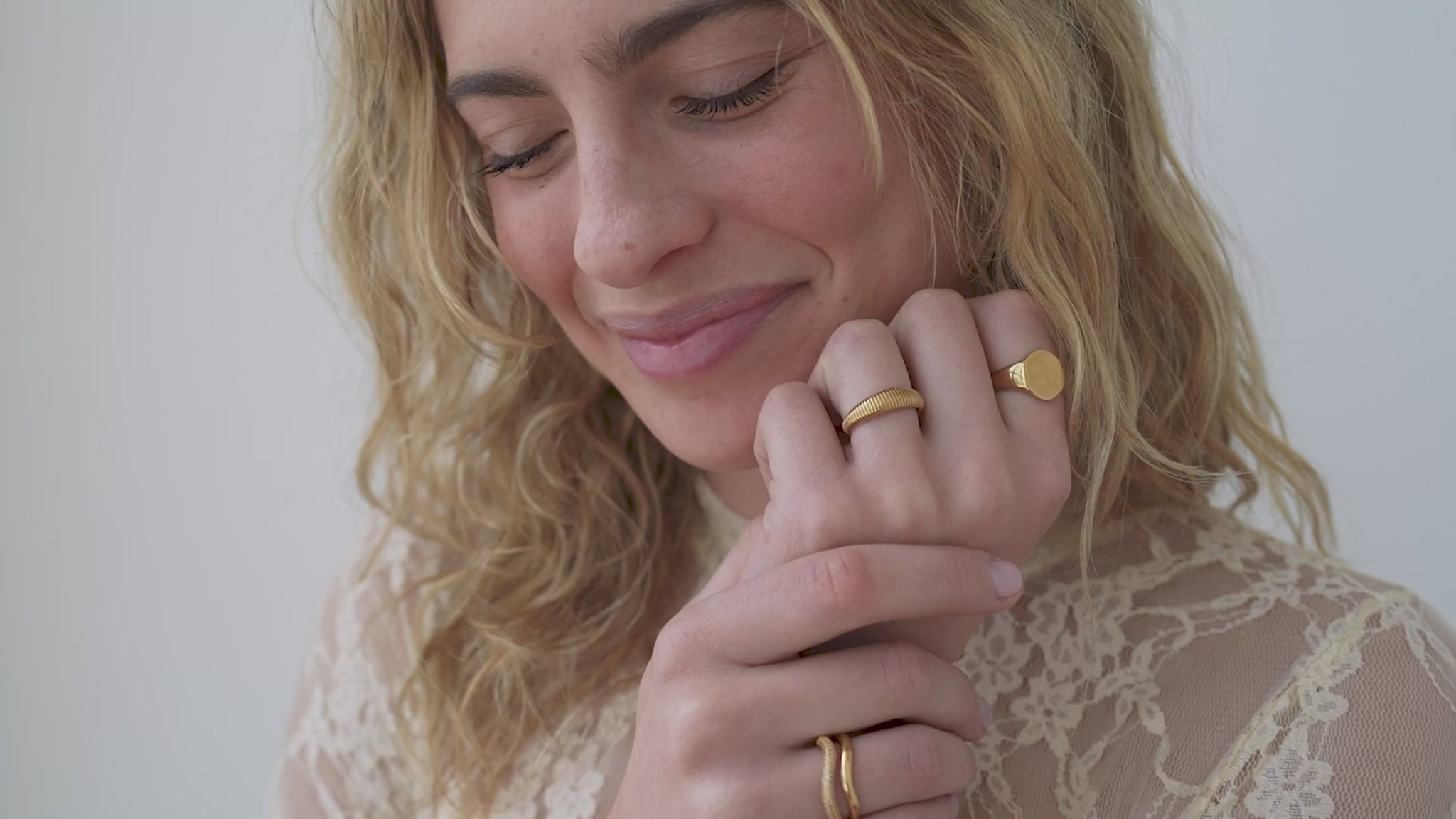 JaxKelly's Gold Ridged Ring and other JaxKelly ring styles on a model.