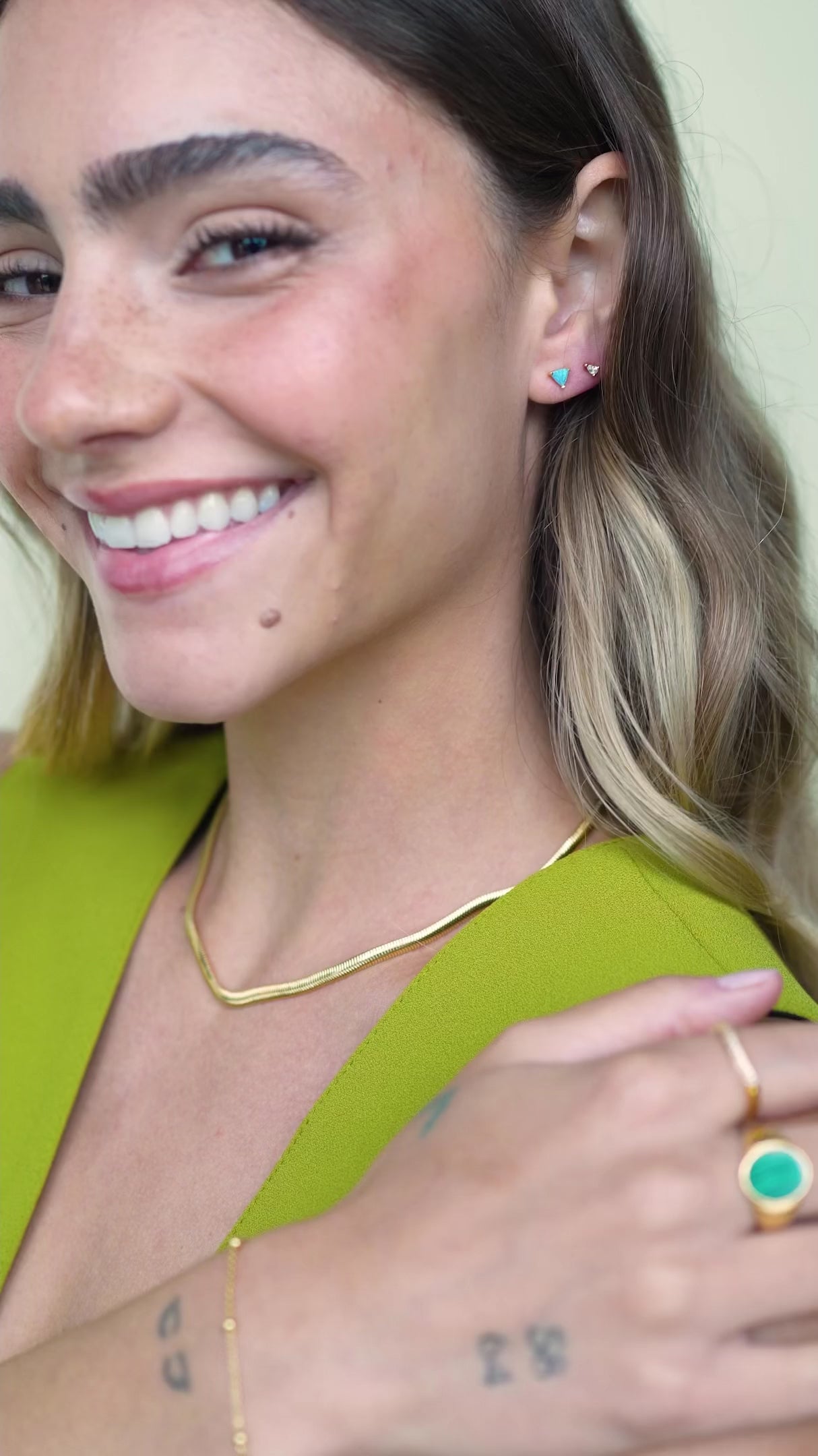 JaxKelly's clear Teardrop Stud earrings on a model.