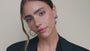 JaxKelly's Silver Wide Hoop Earrings on a model. 