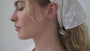 JaxKelly's Silver Organic Hoops on a model.