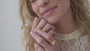 JaxKelly's Inset baguette Ring in White Opal and other JaxKelly ring styles on a model.